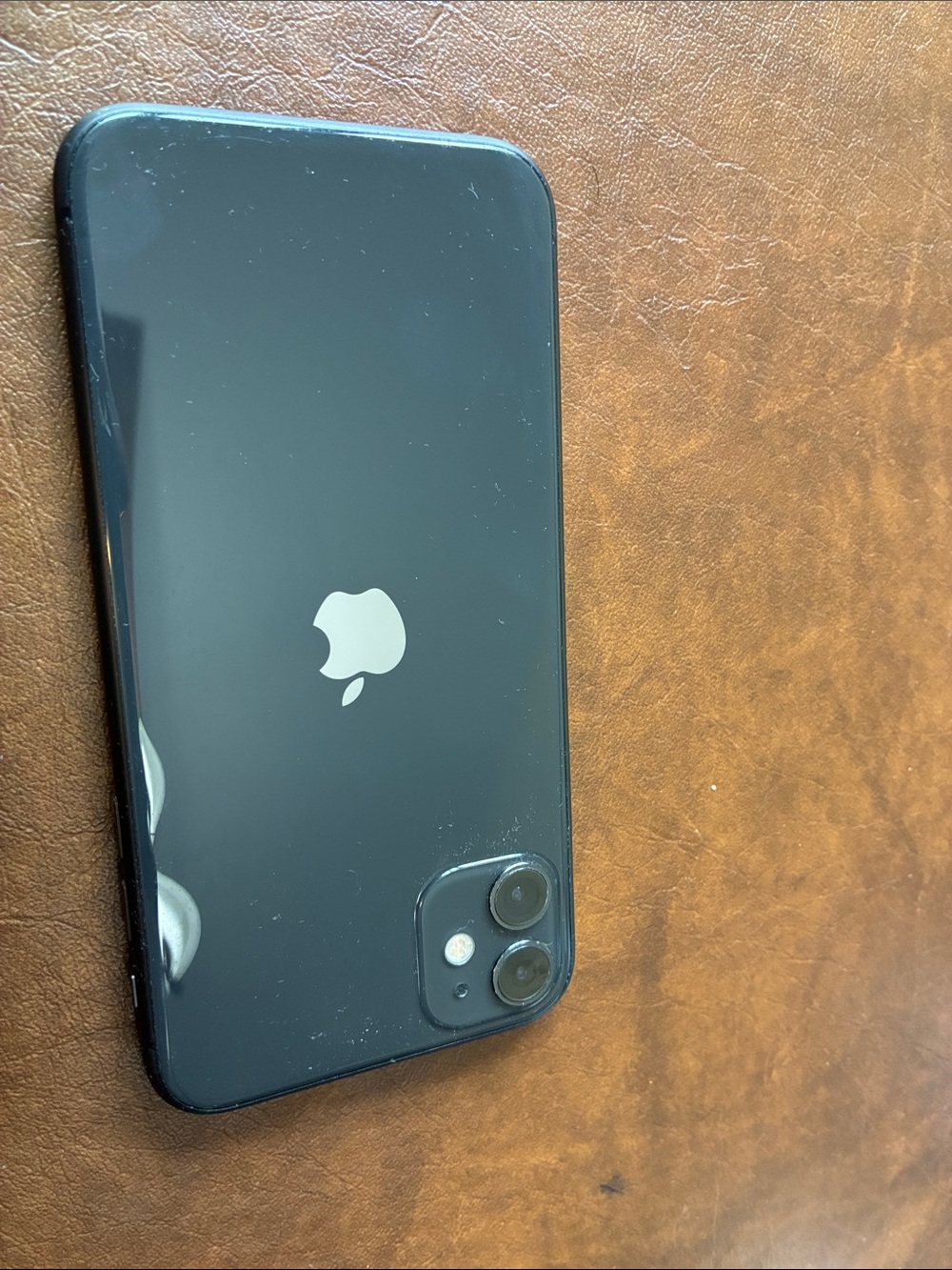 Apple Black iPhone with Dual Rear Cameras and Silver Logo